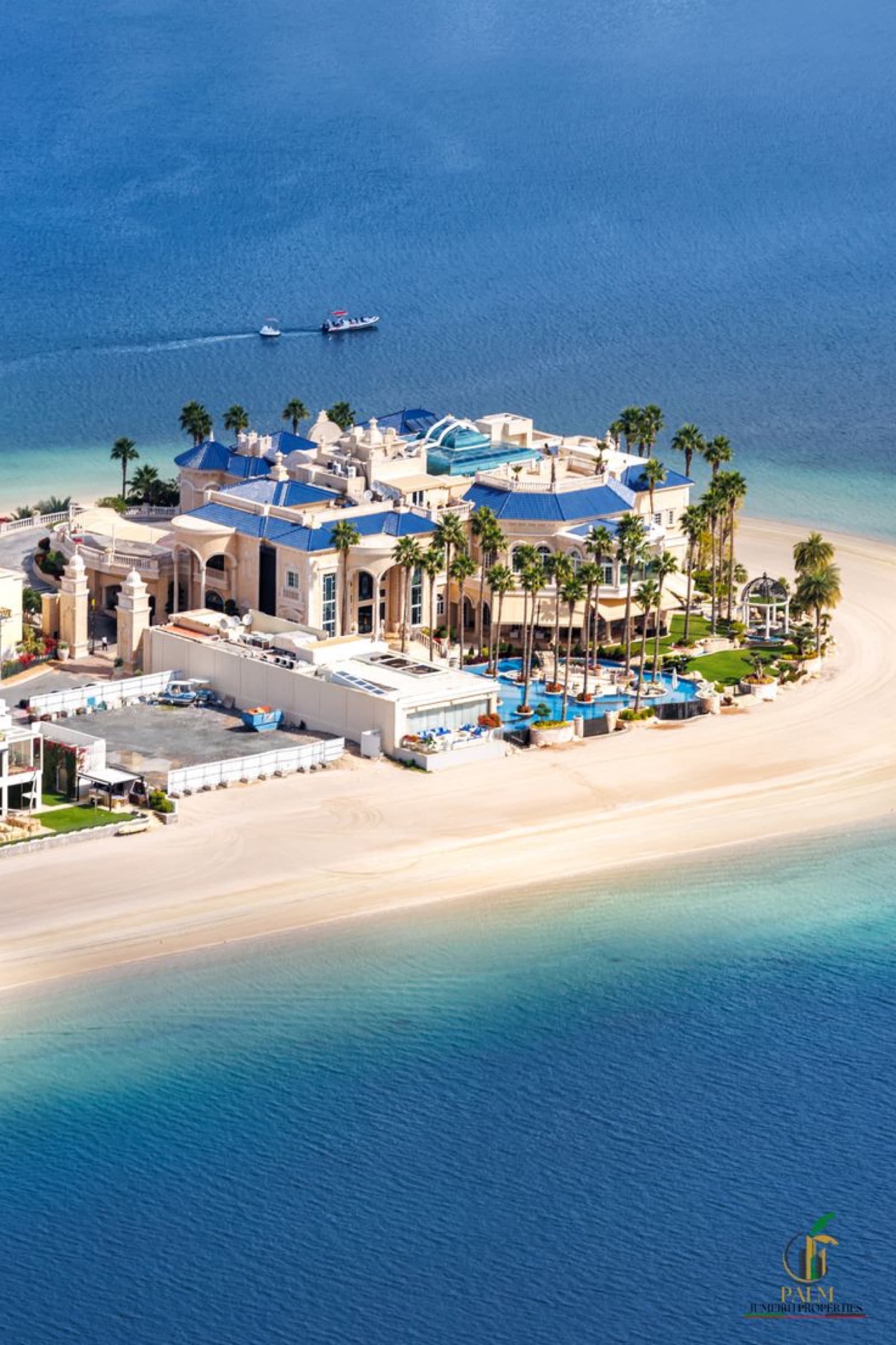 Palm Jumeirah beachfront frond villa aerial view over turquoise water