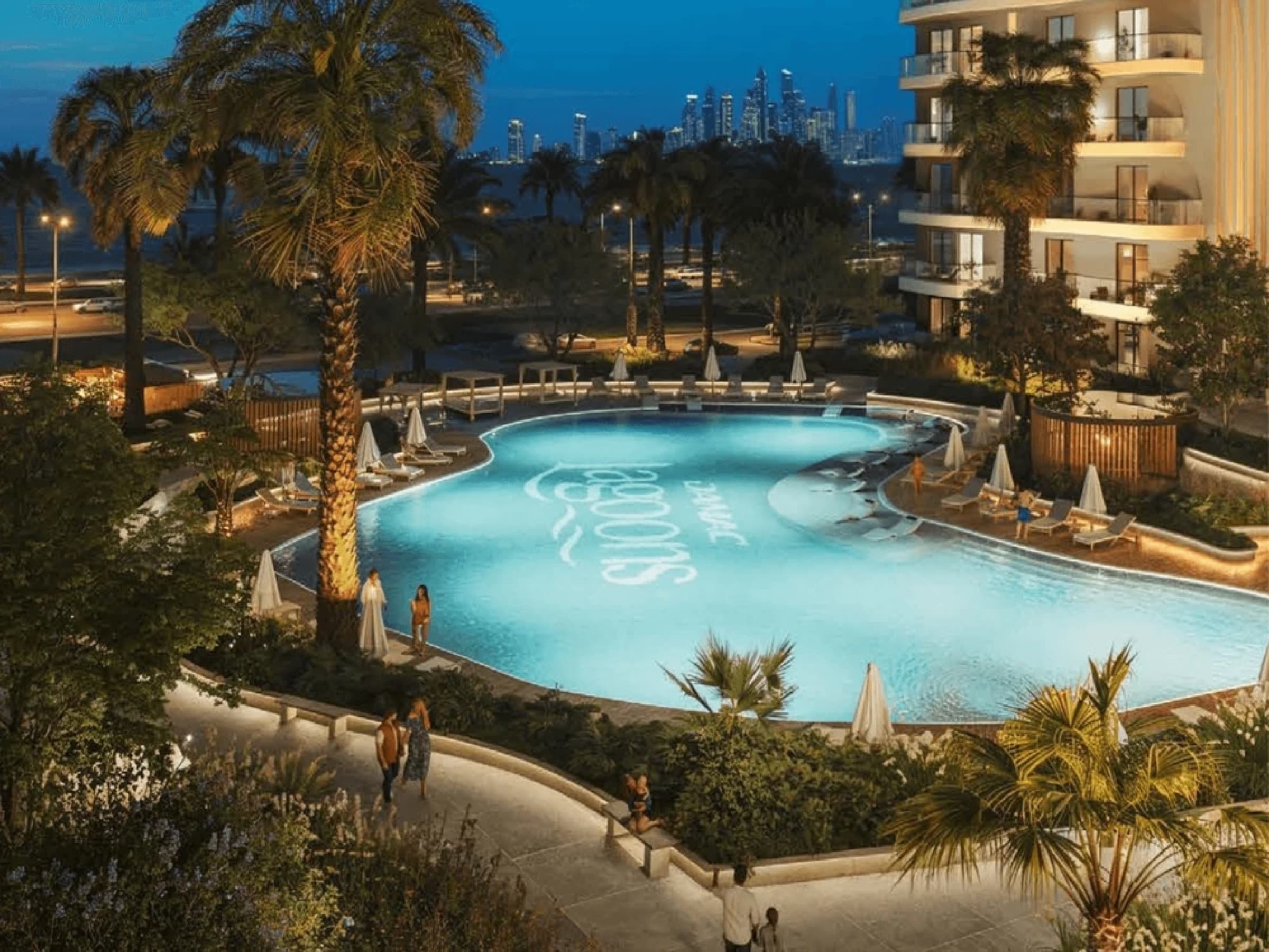 Sorrento resort lagoon pool with Dubai Marina skyline backdrop at dusk